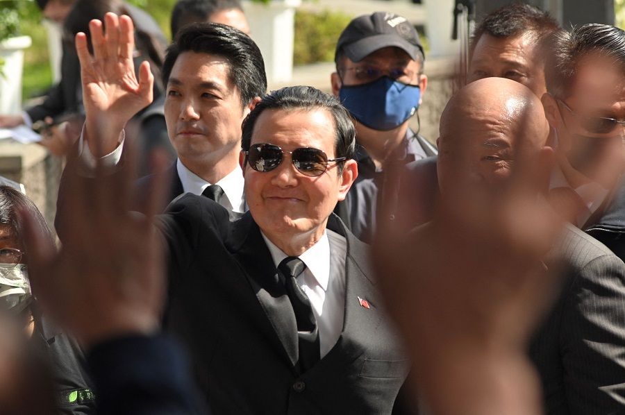 Former Taiwan President Ma Ying-jeou (centre) waves as Taipei mayor Chiang Wan-an (left) follows during a ceremony marking the 76th anniversary of "228 incident" at the 228 Peace Park in Taipei, Taiwan, on 28 February 2023. (Sam Yeh/AFP)