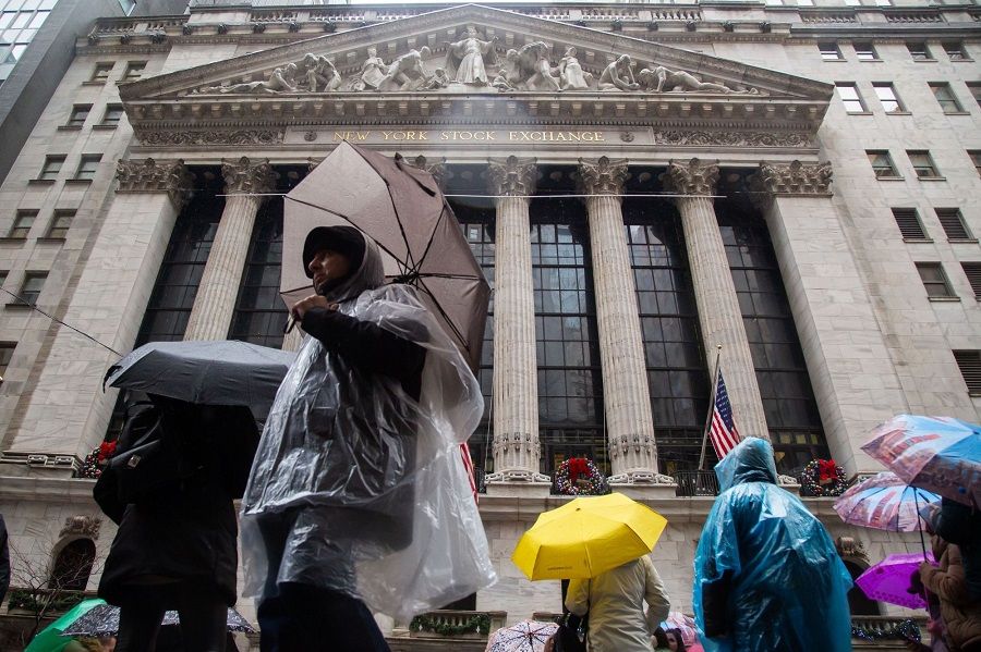 Pedestrians pass in front of the New York Stock Exchange (NYSE) in New York, US, on 3 January 2023. (Michael Nagle/Bloomberg)