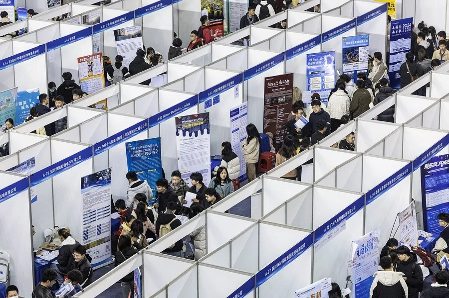 University students attend a job fair in Wuhan, in central China's Hubei province on 6 March 2024.
