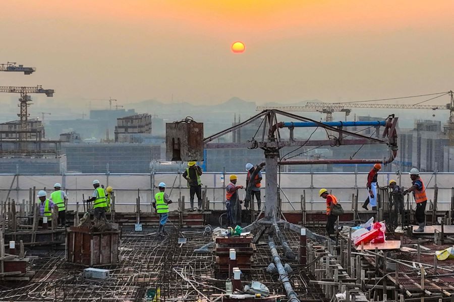 The photo taken on 17 September 2023 shows workers at a construction site of a housing project in Ningbo, Zhejiang province, China. (AFP)
