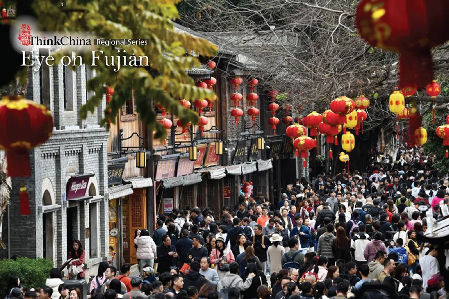 People walk along a street in Fuzhou, Fujian province, China, on 23 February 2026.