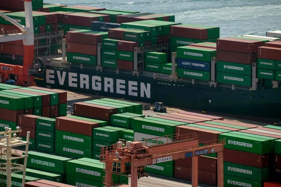 Containers are seen at the international cargo terminal in Tokyo, 18 March 2020. China is a key node in the industrial and supply chain, which has been disrupted due to the Covid-19 outbreak. (Kazuhiro Nogi/AFP)