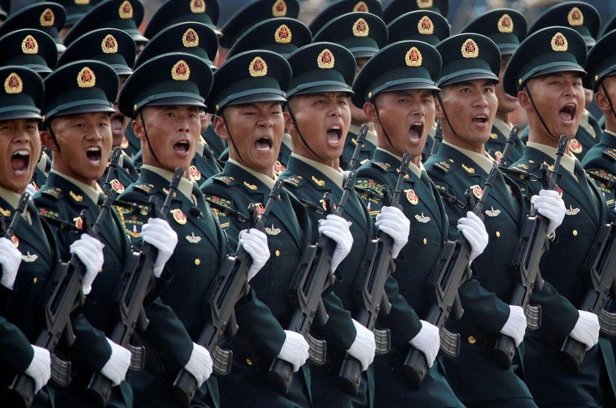 Soldiers of the People's Liberation Army (PLA) march in formation past Tiananmen Square during the military parade marking the 70th founding anniversary of the People's Republic of China, in Beijing, China, on 1 October 2019. (Jason Lee/File Photo/Reuters)