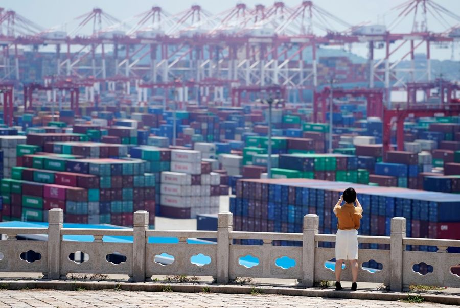China has developed in a globalised world and reaped huge benefits in the process, driven by the country's economic reforms and its people's efforts. The picture shows containers at the Yangshan Deep Water Port in Shanghai, China, on August 6, 2019. (Aly Song/File Photo/Reuters)