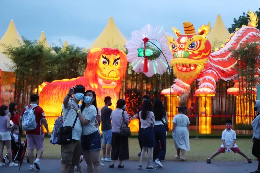 A young couple taking a selfie at the River Hongbao 2021 festival held at Gardens by the Bay, Singapore, on 13 February 2021. (SPH)