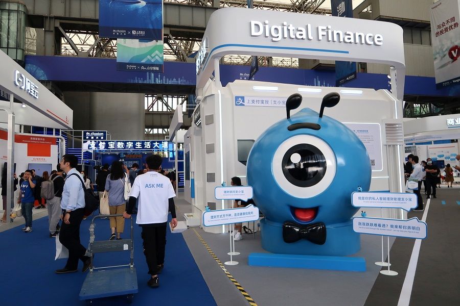 A booth of digital finance products is seen at a fair during the INCLUSION fintech conference in Shanghai, China, 24 September 2020. (Cheng Leng/Reuters)