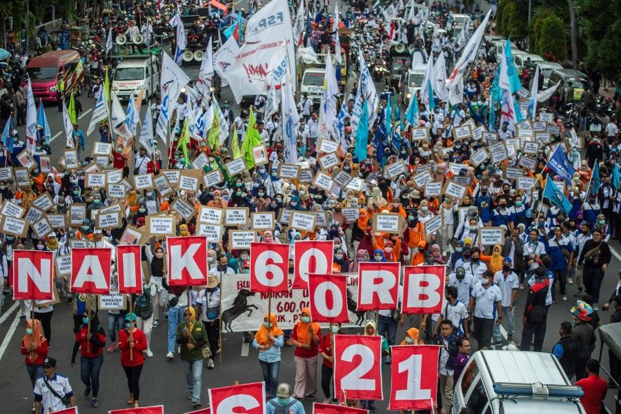 Activists protest against the labour law passed by Indonesia's parliament in October, in Surabaya on 19 November 2020. (Photo by Juni Kriswanto/AFP)