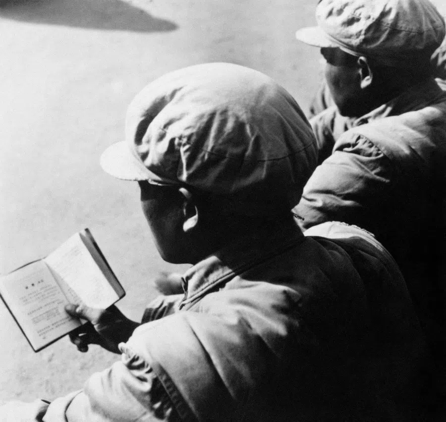 A Chinese Red Guard reads Chairman Mao Zedong "Little Red Book" during a rally in Beijing, 21 January 1967 during the "great proletarian cultural revolution". (Jean Vincent/AFP)