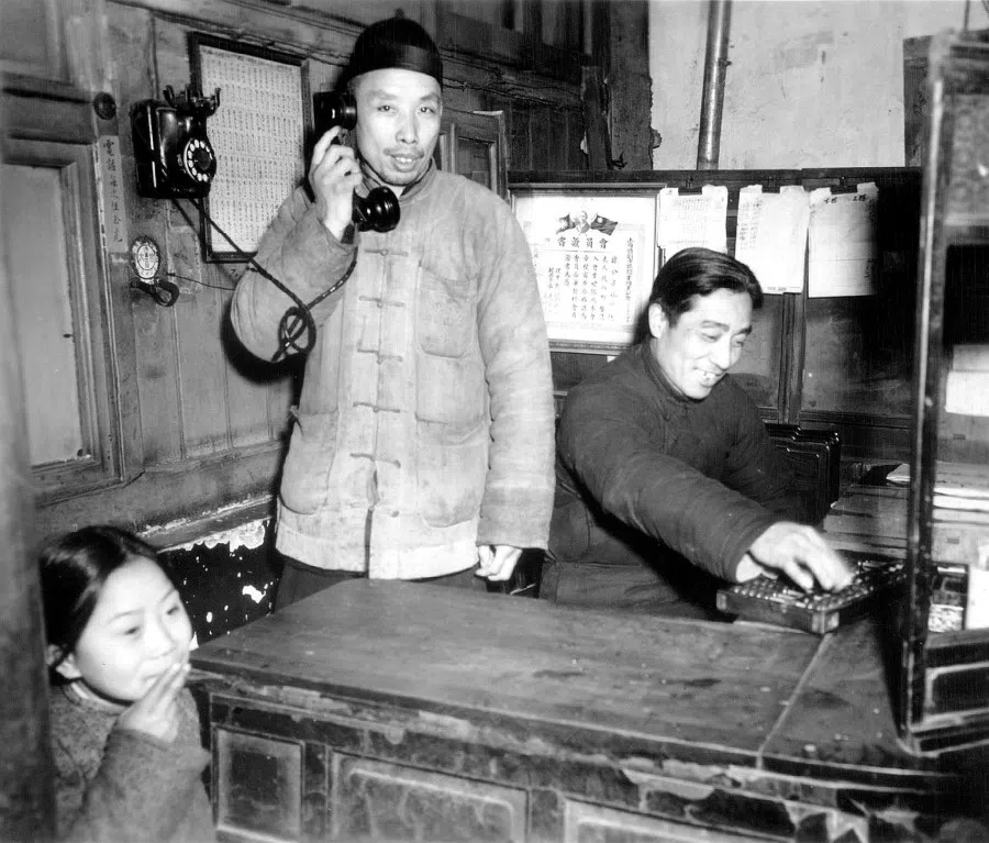 A customer uses a phone in a store.