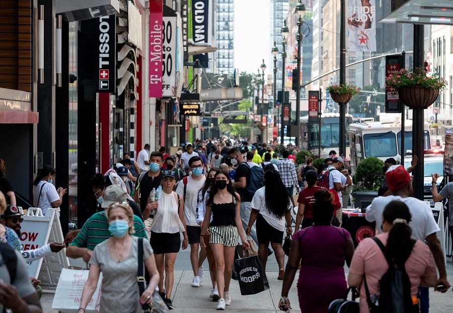 People walk through a shopping area in Manhattan on 7 June 2021 in New York City, US. (Angela Weiss/AFP)