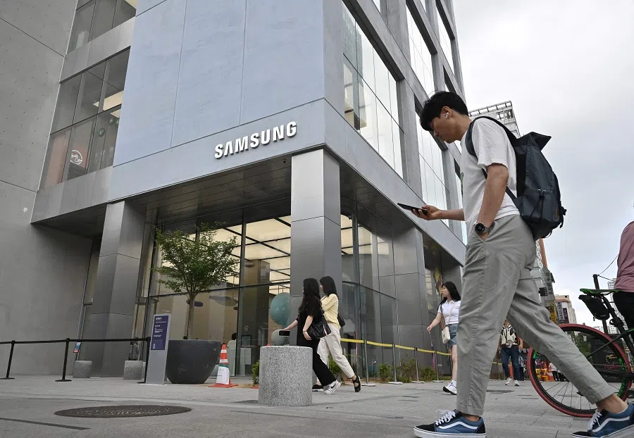 A man walks past a new flagship store of Samsung Electronics at the Gangnam district in Seoul, South Korea, on 28 June 2023. (Jung Yeon-je/AFP)