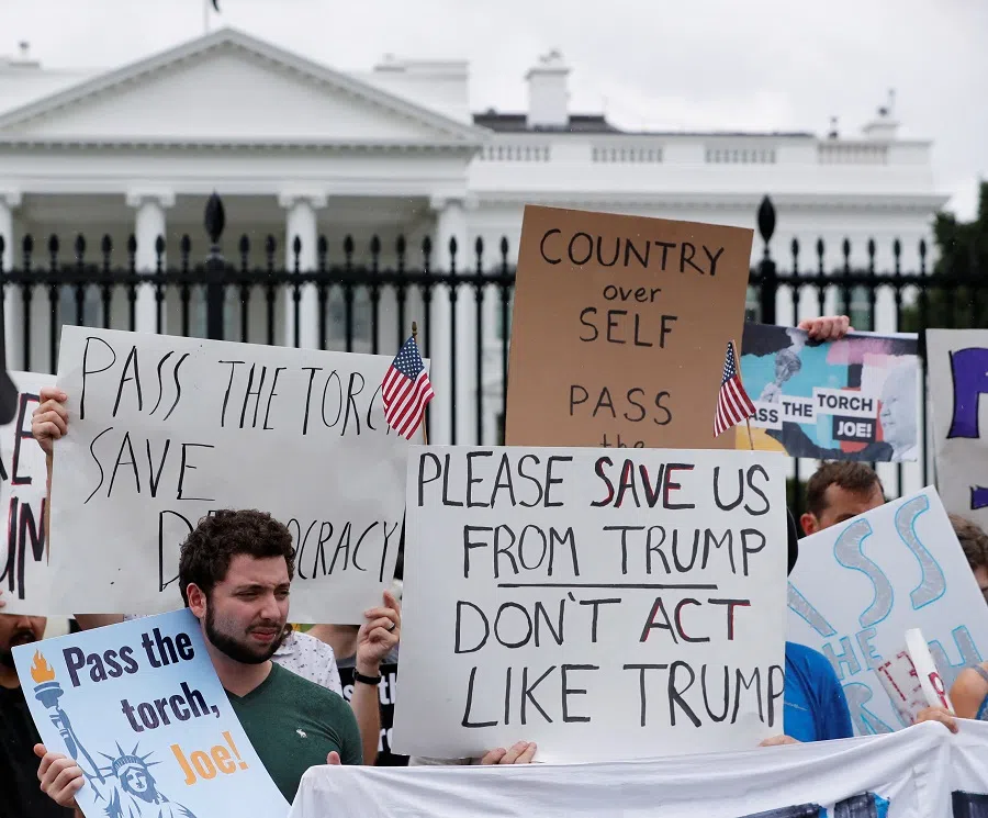 Demonstrators demand that US President Joe Biden withdraw from the 2024 elections, outside the White House in Washington, US, on 20 July 2024. (Allison Bailey/Reuters)