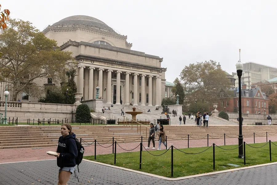 People walk past Columbia University in New York, US, on 30 October 2023. (Jeenah Moon/Reuters)