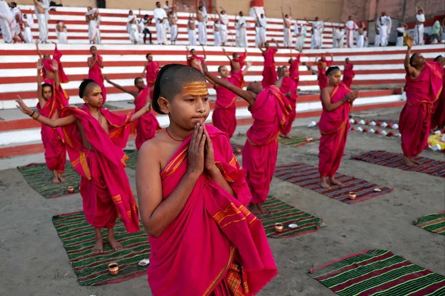 Students from a Hindu religious school perform yoga to welcome the rising sun on the occasion of the Hindu new year on the banks of the Ganges River at Kedar Ghat in Varanasi, India, on 9 April 2024. (Niharika Kulkarni/AFP)