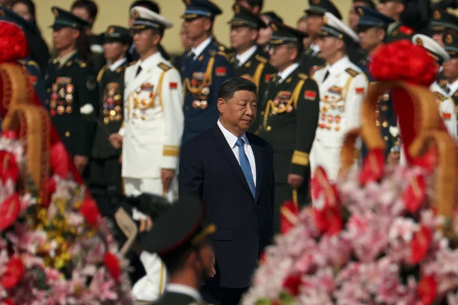 Chinese President Xi Jinping walks past floral baskets and members of the Chinese People's Liberation Army (PLA) as he arrives for a ceremony at Tiananmen Square in Beijing, China, 30 September 2025.