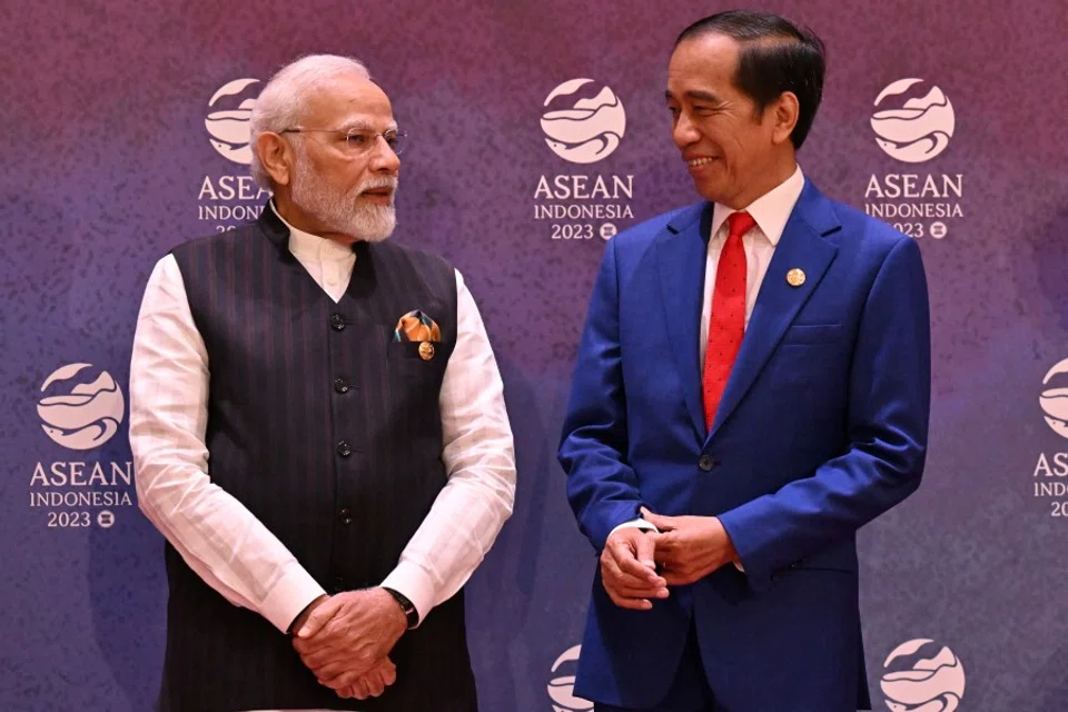 India's Prime Minister Narendra Modi (left) talks to Indonesia's President Joko Widodo (right) prior to a photo session during the 20th ASEAN-India Summit as part of the 43rd ASEAN Summit in Jakarta on 7 September 2023. (Adek Berry/Pool via Reuters)