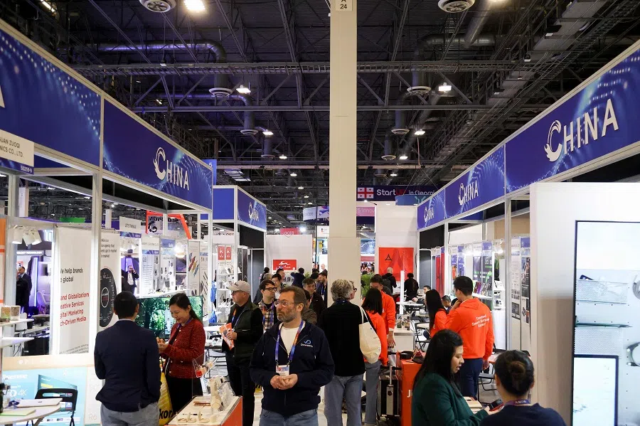 Attendees walk past a row of Chinese businesses in Eureka Park at CES (Consumer Electronics Show) on 8 January 2025, in Las Vegas, US. (Ian Maule/AFP)