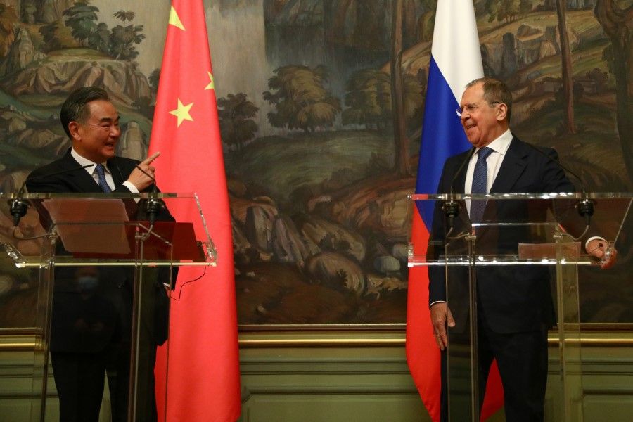 China's State Councilor Wang Yi gestures next to Russia's Foreign Minister Sergei Lavrov as they attend a news briefing after their meeting in Moscow, Russia, 11 September 2020. (Russian Foreign Ministry/Handout via REUTERS)
