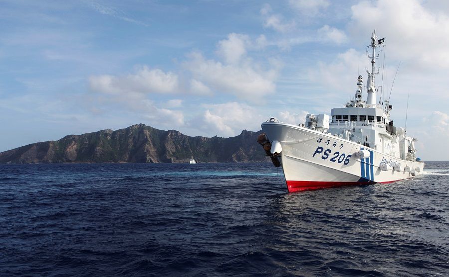 Senkaku Islands, in this case with a Japan Coast Guard vessel in the foreground. ( Ruairidh Villar/Reuters)