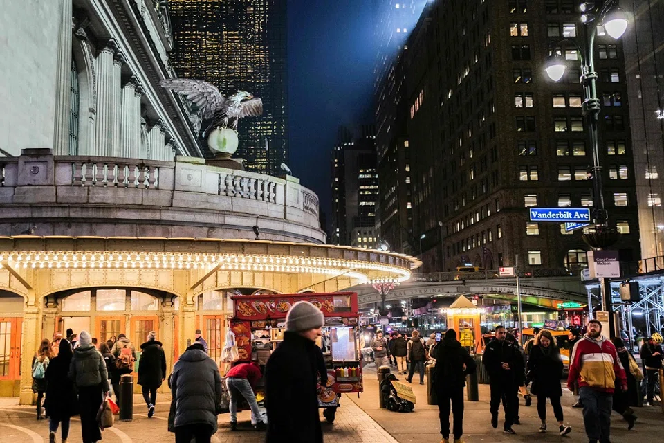 People walk outside Grand Central Terminal in New York on 26 January 2024. (Charly Triballeau/AFP)