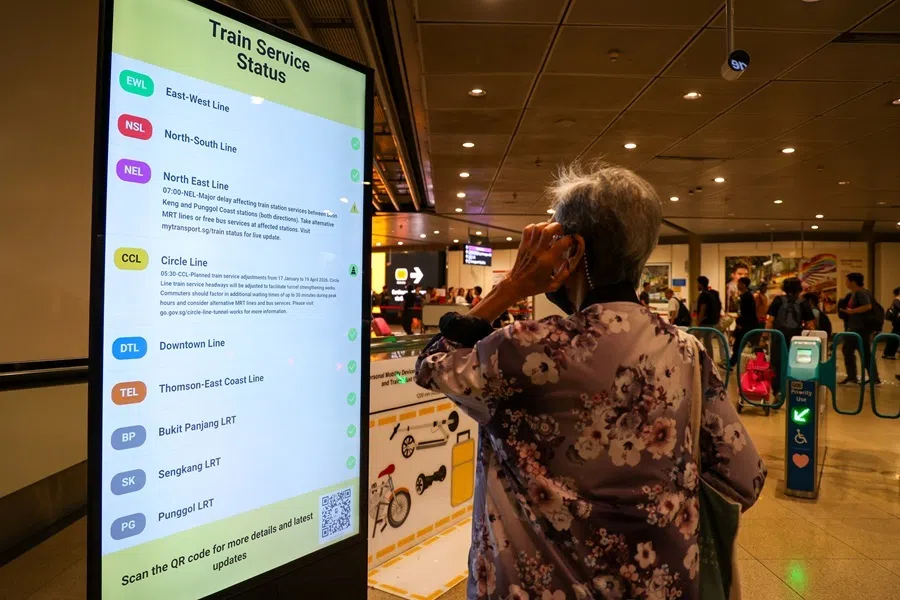 A man checking the screen for train information at Serangoon MRT station, Singapore,  on 22 January 2026.