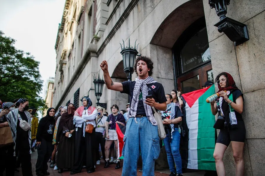 A pro-Palestinian protestor shouts slogans during a protest outside Columbia University, in New York City on 23 May 2024.