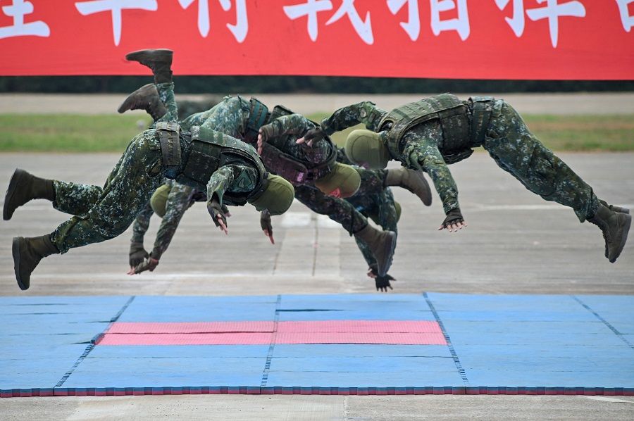 A Taiwanese special forces unit demonstrate their combat skills during a military open house event in Hsinchu, Taiwan, on 21 September 2023. (Sam Yeh/AFP)