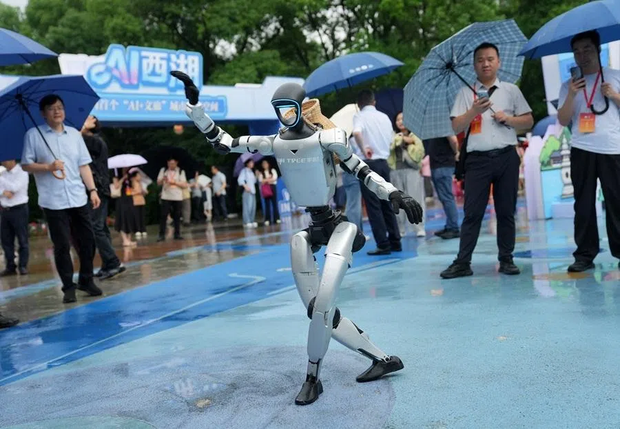 A Unitree robot dances in the rain during an event at West Lake in Hangzhou, 24 June 2026.