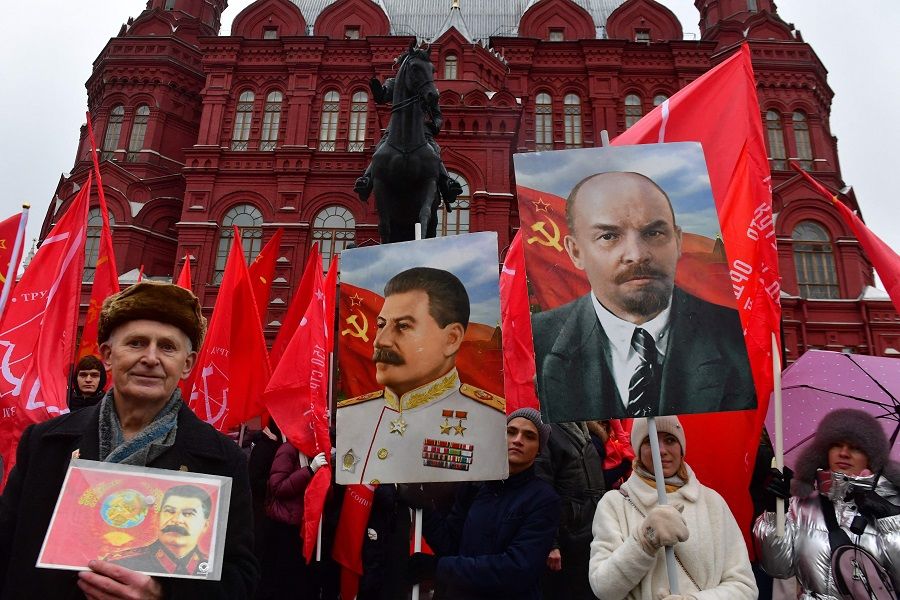 Russian Communist party supporters gather to lay flowers to the tomb of late Soviet leader Joseph Stalin to mark the 144th anniversary of his birth at Red Square in Moscow, Russia, on 21 December 2023. (Olga Maltseva/AFP)