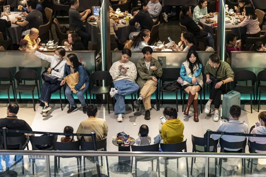 Customers wait outside a restaurant at a shopping mall in Shenzhen, China, on 19 January 2024. (Qilai Shen/Bloomberg)