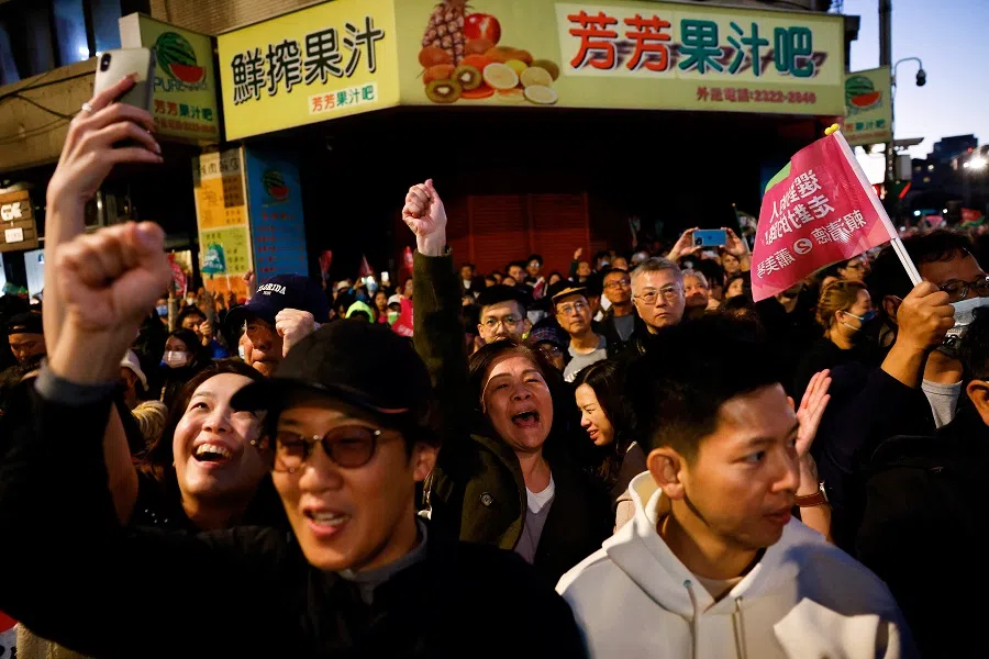 People react as they gather near the Democratic Progressive Party (DPP) headquarters on the day of the presidential and parliamentary elections in Taipei, Taiwan, on 13 January 2024. (Ann Wang/Reuters)