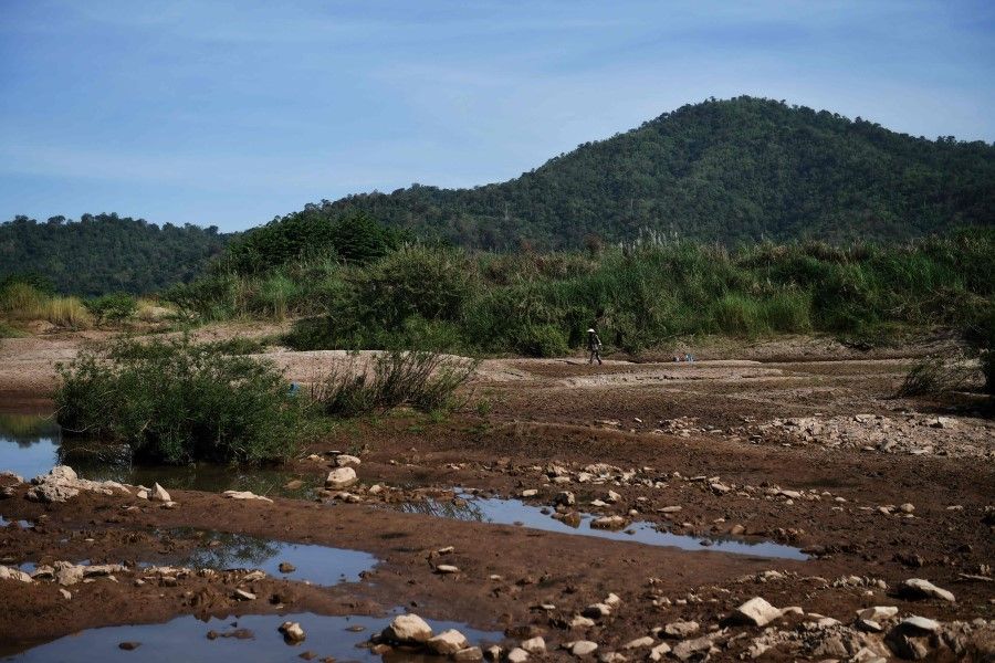 This file photo taken on 31 October 2019 shows a dried riverbank area of Mekong River in Pak Chom district in the northeastern Thai province of Loei. China was pressed on 16 June 2020 to share year-round data on water levels when it operates its dams on the Mekong River, after drought and record lows in downstream countries last year threatened the livelihoods of millions. (Photo by Lillian Suwanrumpha/AFP)