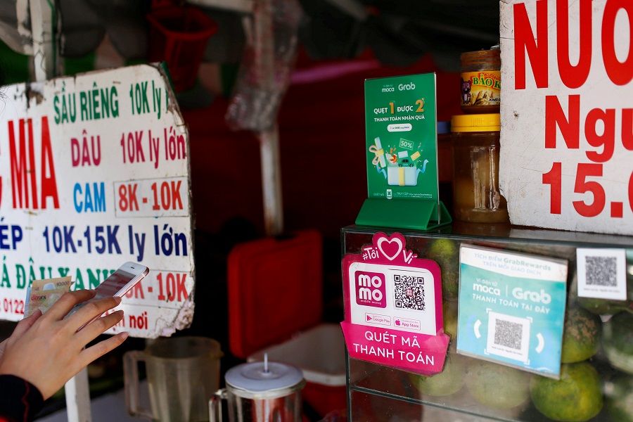 Mobile e-payment logos are seen at a street food stall in Ho Chi Minh City in Vietnam, 15 October 2019. (Yen Duong/File Photo/Reuters)