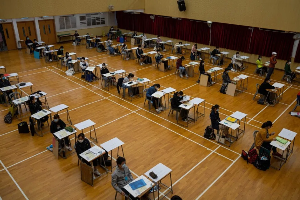 Students sit for the Diploma of Secondary Education (DSE) university entrance exams in Hong Kong, 24 April 2020. (Jerome Favre/AFP)