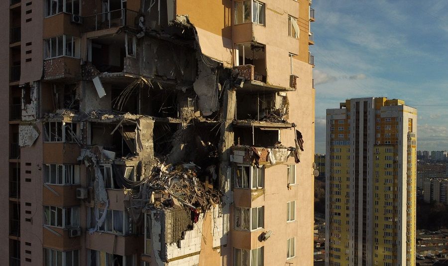 This general view shows damage to the upper floors of a building in Kyiv, Ukraine, on 26 February 2022, after it was reportedly struck by a Russian rocket. (Daniel Leal/AFP)