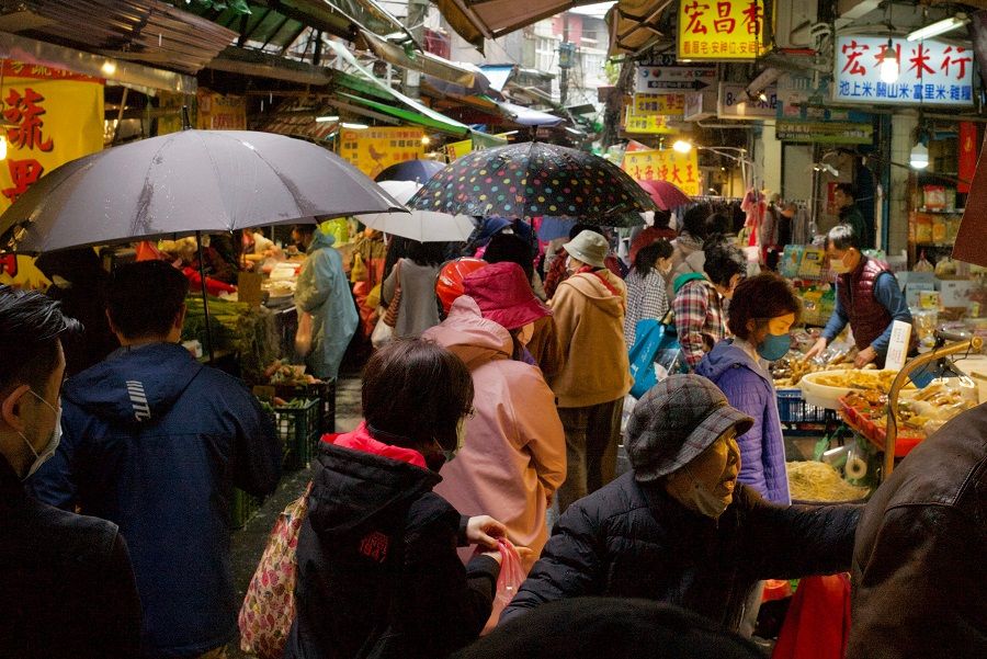 People select goods at a traditional market in New Taipei City, Taiwan, on 21 January 2023. (Sam Yeh/AFP)