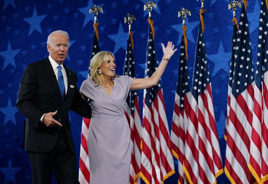 In this file photo taken on 20 August 2020, Democratic presidential nominee Joe Biden and his wife Jill Biden stand on stage at the Chase Center in Wilmington, Delaware, at the conclusion of the Democratic National Convention. (Olivier Douliery/AFP)