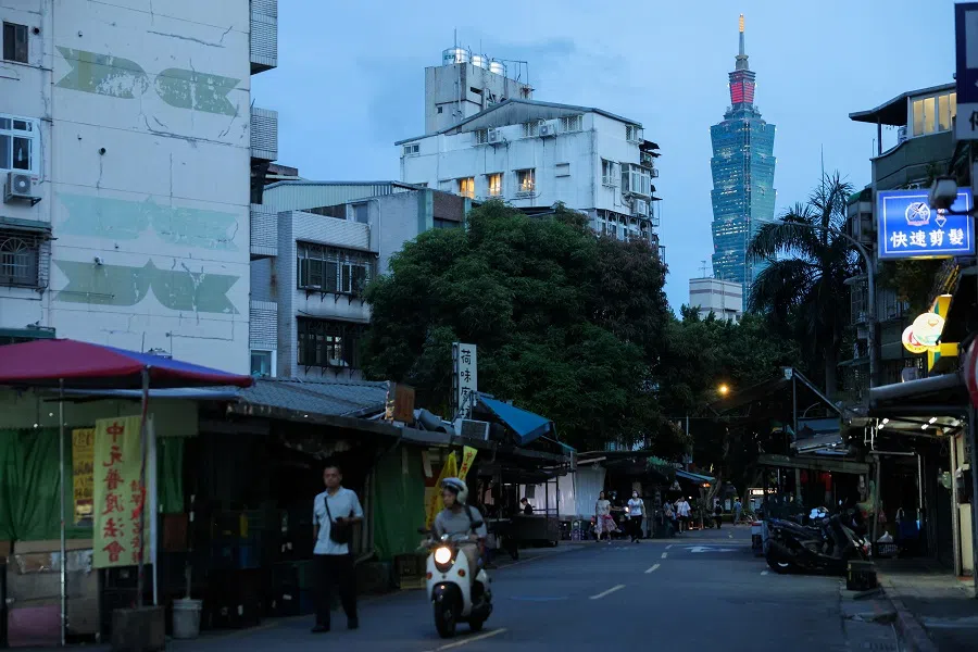 People drive by Taipei 101 in Taipei, Taiwan, on 15 July 2024. (Ann Wang/Reuters)
