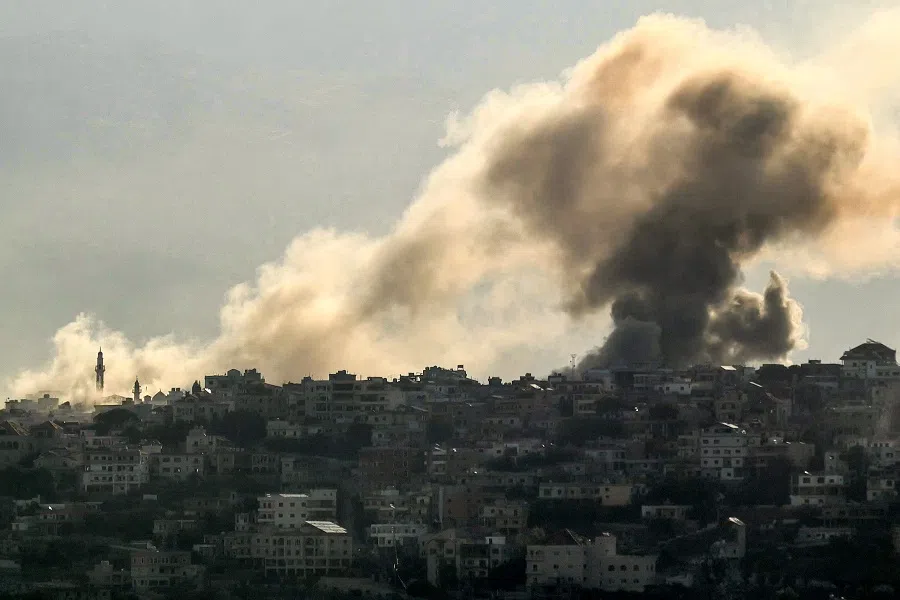 Smoke rises from the site of an Israeli air strike that targeted the southern Lebanese village of Khiam on 9 October 2024.