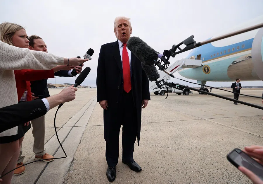 US President Donald Trump speaks to reporters before boarding Air Force One as he departs from Joint Base Andrews in Maryland, US, on 14 March 2025.