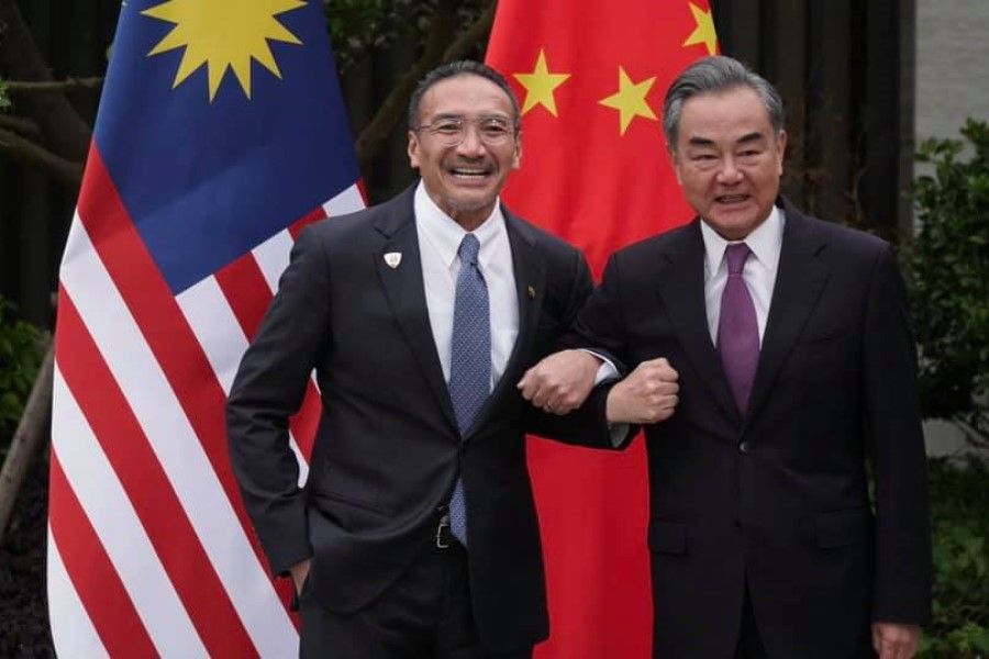 Malaysia's Foreign Minister Hishammuddin Hussein with China's Foreign Minister Wang Yi, 1 April 2021. (Hishammuddin Hussein/Facebook)