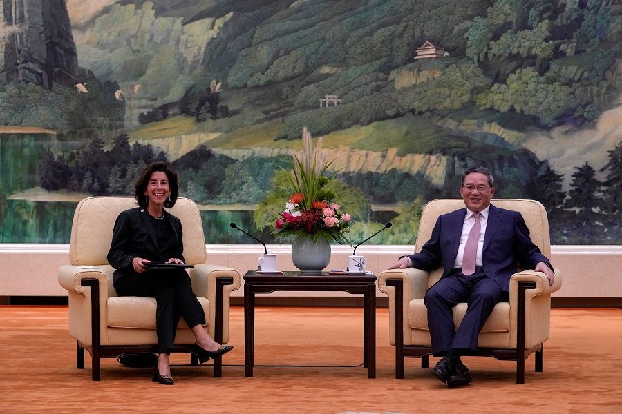 US Commerce Secretary Gina Raimondo and Chinese Premier Li Qiang have a light moment during a meeting at the Great Hall of the People in Beijing, China, on 29 August 2023. (Andy Wong/Pool via Reuters)