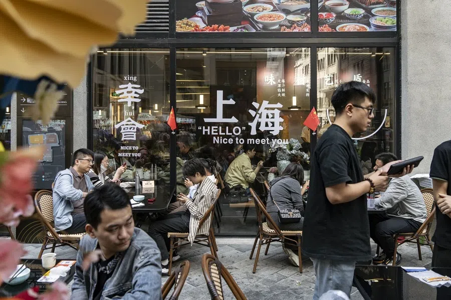 Customers at a restaurant on Nanjing East Road in Shanghai, China, 2 October 2024. (Qilai Shen/Bloomberg)