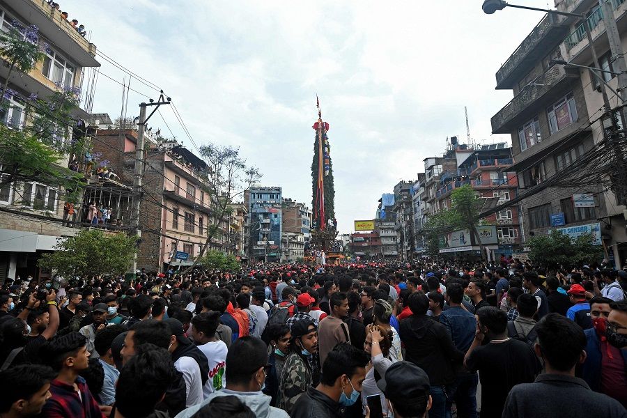 Devotees pull a chariot as they take part in the festivities to mark the Rato Machindranath chariot festival in Lalitpur, Nepal, on 4 May 2022. (Prakash Mathema/AFP)