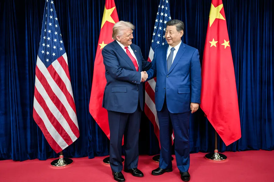 US President Donald Trump shakes hands with Chinese President Xi Jinping as they participate in a bilateral meeting at the Gimhae Air Base on 30 October 2025.