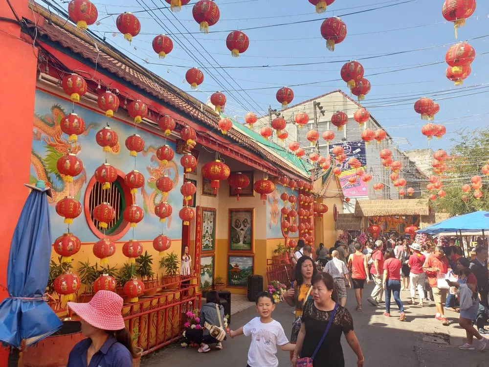 Families on a street in the Chinatown area of Chiang Mai, Thailand. (PM Tours/Internet)
