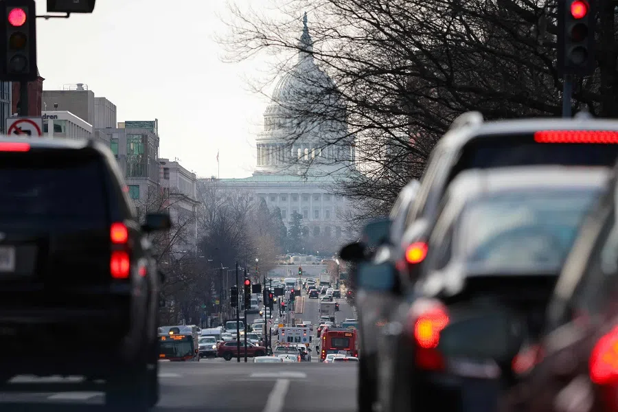 Cars drive on North Capitol Street during rush hour traffic as US President Donald Trump’s return to work order begins on 10 February 2025 in Washington, DC. (Kayla Bartkowski/Getty Images via AFP)