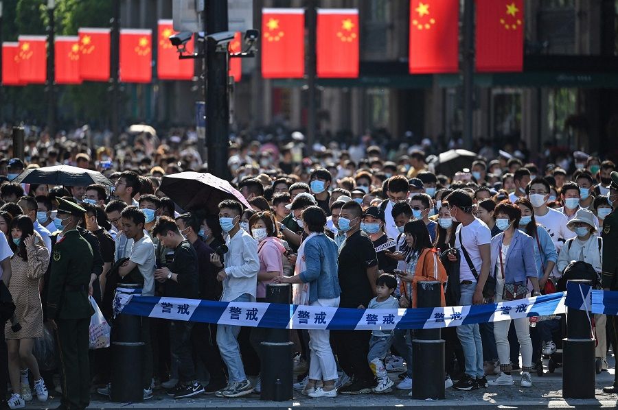 People visit the Bund during a Labour Day holiday in Shanghai, China on 1 May 2021. (Hector Retamal/AFP)