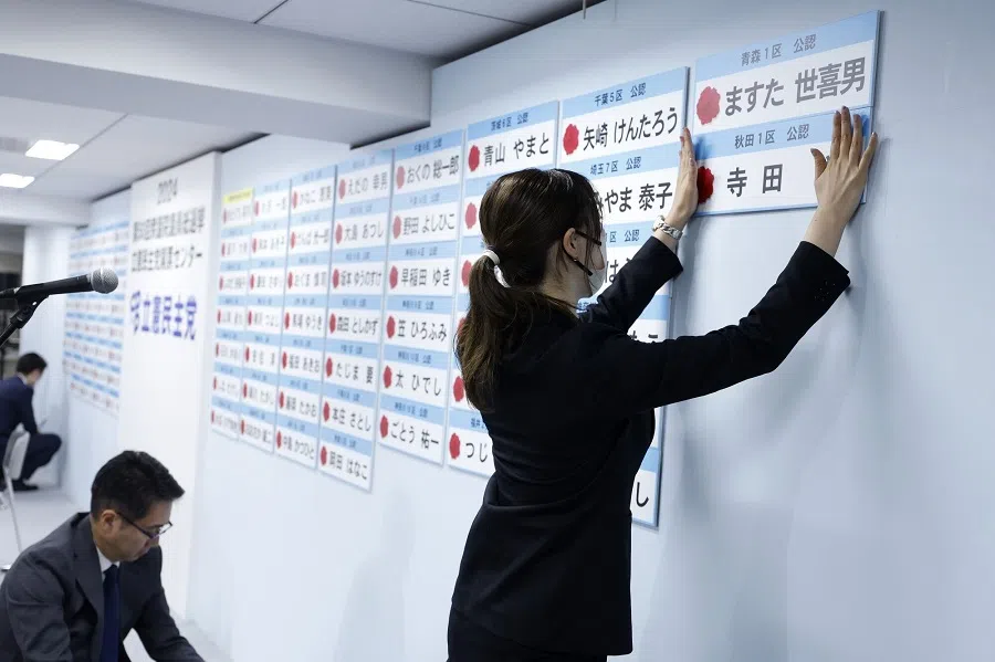 A staff member places name plates of the Constitutional Democratic Party of Japan (CDPJ) candidates to indicate victories in the lower house election, at the party’s headquarters in Tokyo, Japan, on 28 October 2024. (Kiyoshi Ota/Bloomberg)