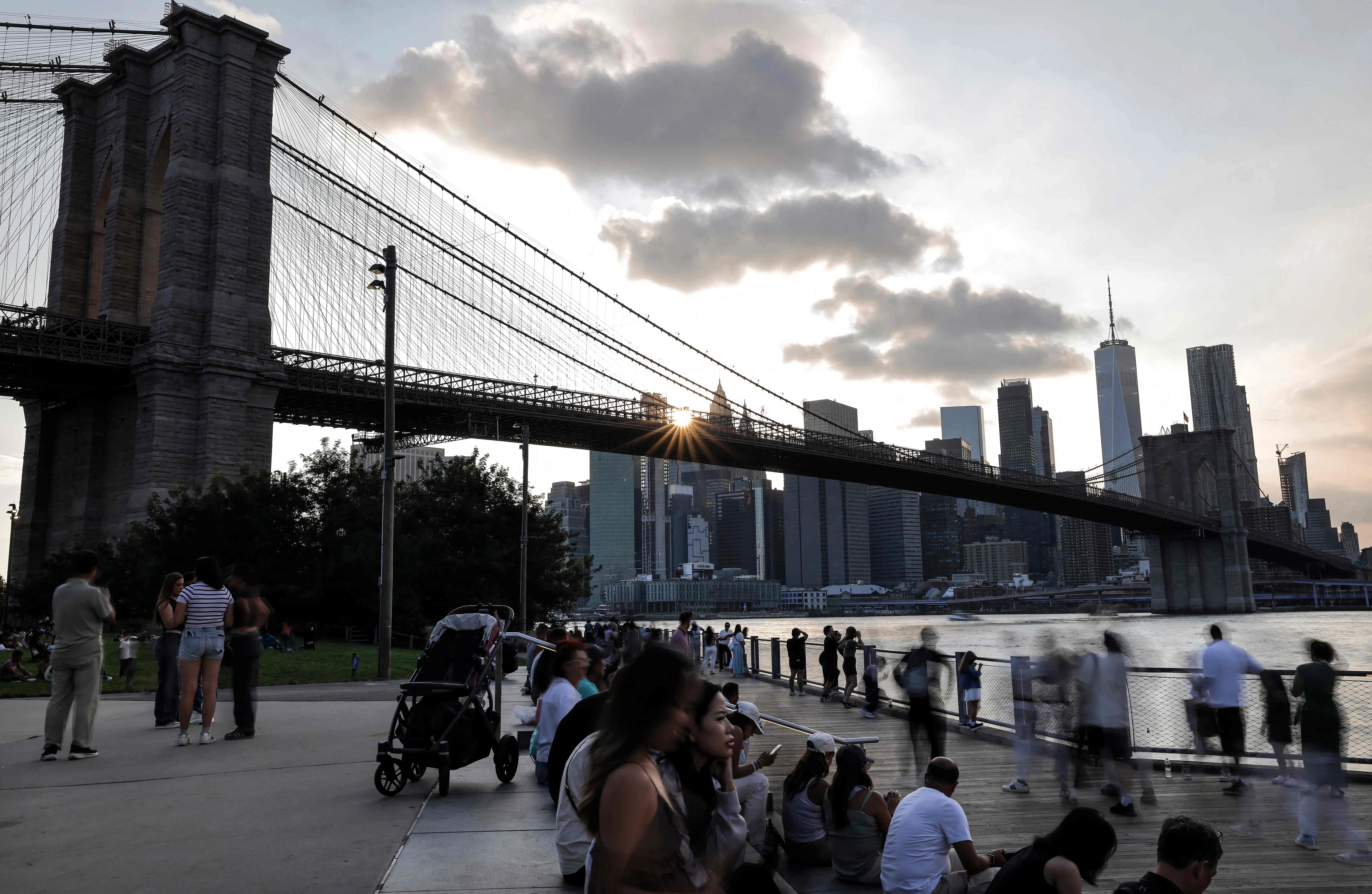 People gather near the Brooklyn Bridge on 22 August 2026 in the Brooklyn borough of New York City.